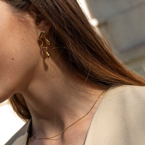Contemporary statement gold earrings
