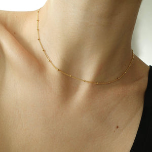 Beaded gold choker necklace