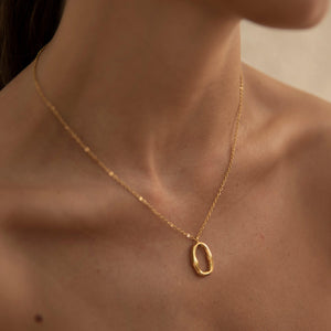 Gold oval pendant necklace