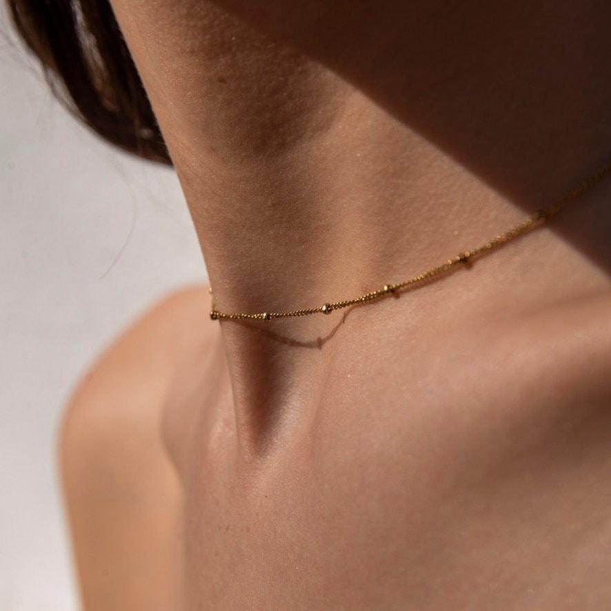 Satellite gold choker necklace